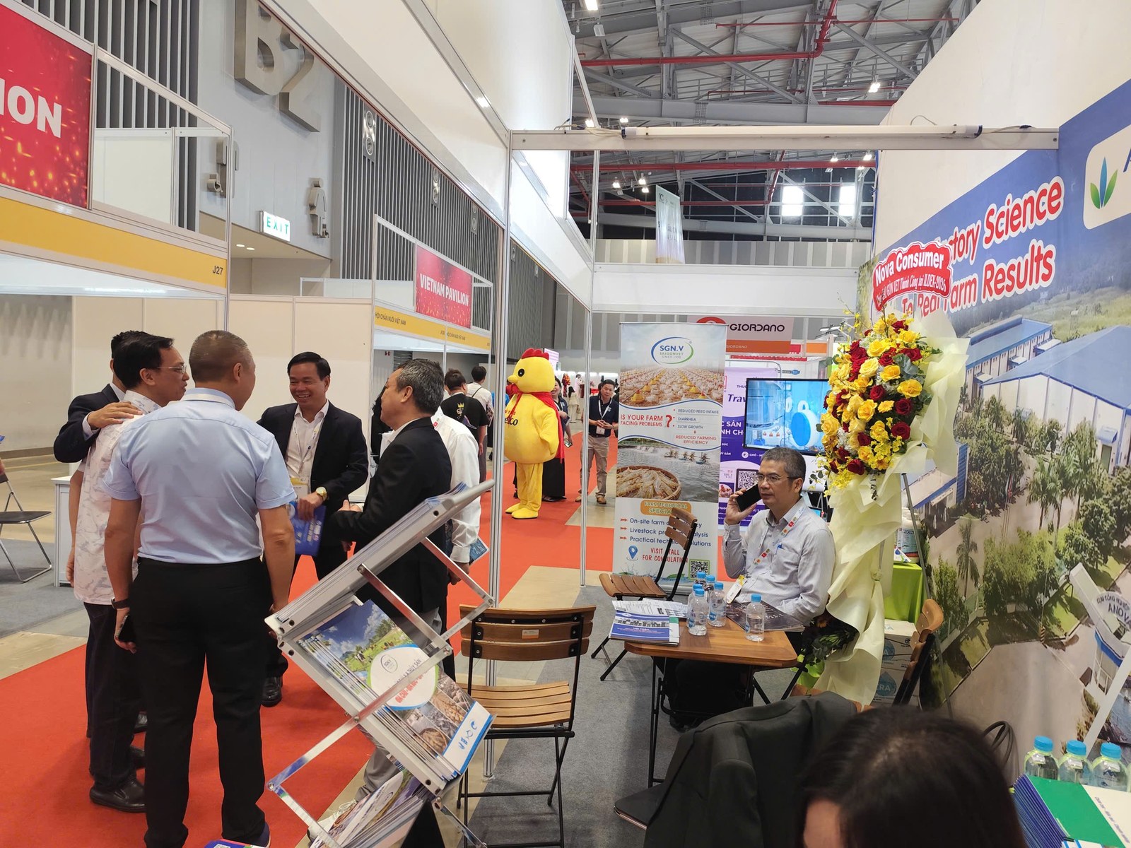 Visitors at the SaigonVet booth on opening day